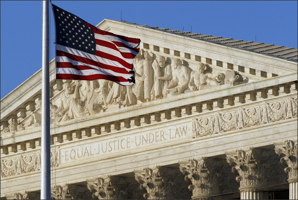 An American flag flies in front of the Supreme Court in Washington. --Alex Brandon/AP-File
